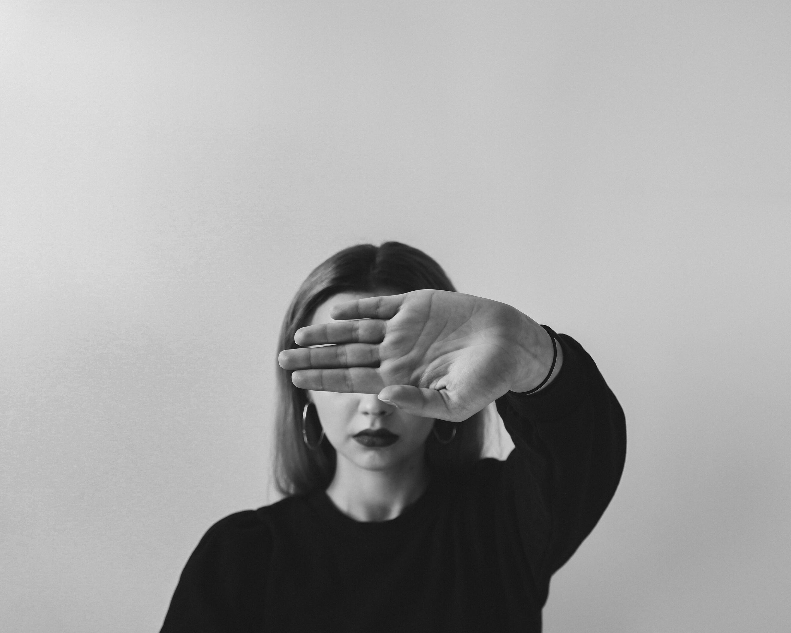 Sensitive Lady Highly sensitive woman feeling overwhelmed, hand to her face